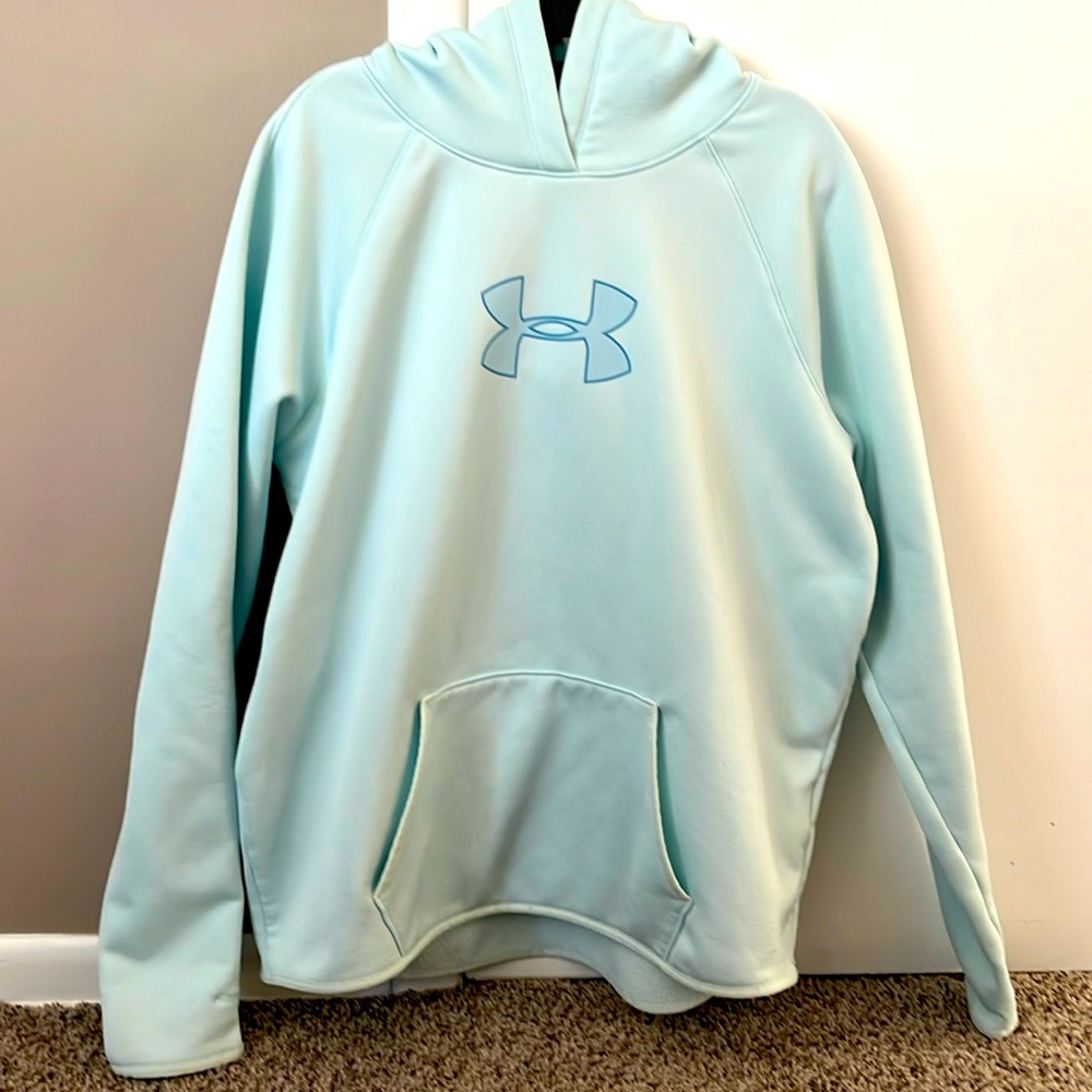 Women’s Under Amour hooded sweatshirt with thumb holes on sleeves.